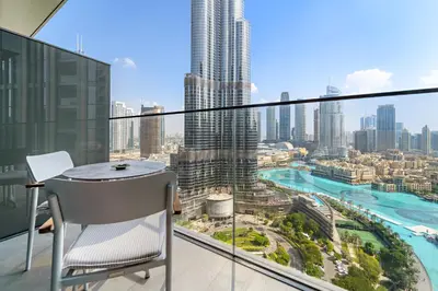a balcony with a table and a view of a city at Address Residence Dubai Opera 34 by Luxstay Holiday Homes in Dubai