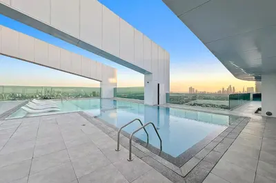 a swimming pool in a building with a view at Dubai Frame Views Steps from Metro & Sheikh Zayed Road in Dubai