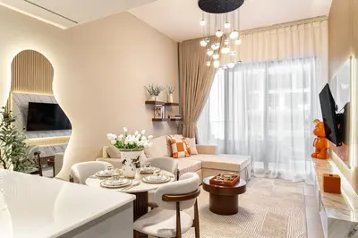a living room with a couch and a table at Burj et Canal View Sunny Pool in Dubai