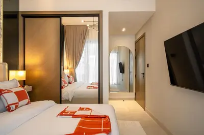 a hotel room with a bed and a large mirror at Burj et Canal View Sunny Pool in Dubai