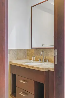 a bathroom with a sink and a mirror at Bellavista - 1 Bedroom Apartment - 29 Boulevard in Dubai