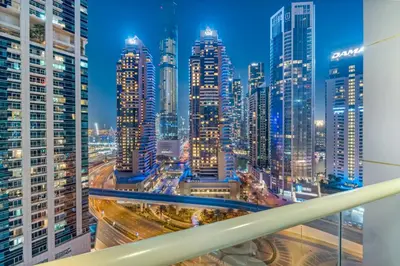 a view of a city skyline at night at Modern 1BR JBR View No Car Needed! in Dubai