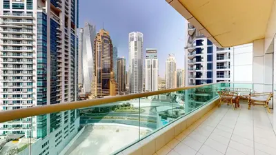 a balcony with a view of a city skyline at Royal Oceanic - Bright Two Bed on the 14th Floor in Dubai