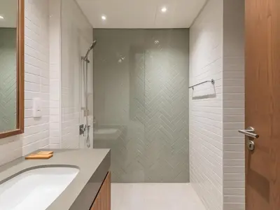 a bathroom with a shower and a sink and a tub at TRPS - Central Park, City Walk, Al Wasl - 2BR Modern Residence - Elegantly Furnished to High Standards in Dubai