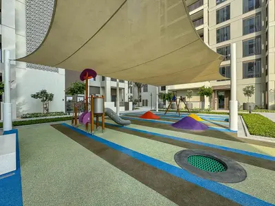 a playground in a building with a play area at Vibrant 1BR With Airy Patio, Beach, Pool and Gym Access in Dubai