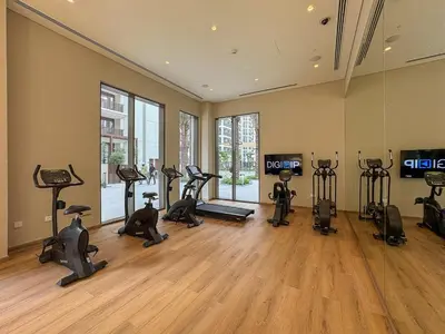 a gym with many exercise bikes in a room at Vibrant 1BR With Airy Patio, Beach, Pool and Gym Access in Dubai