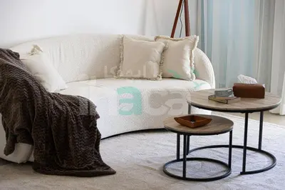 a living room with a couch and two tables at Luxury 1 Br Marina Near Tram Ain Sea View Balcony in Dubai