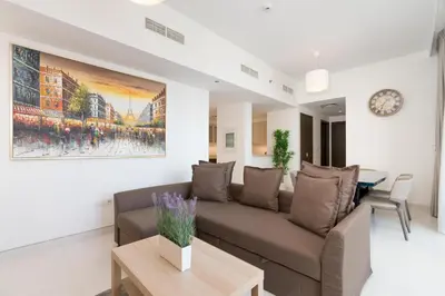 a living room with a couch and a table at Creek Side 18 I Harbor Views I in Dubai
