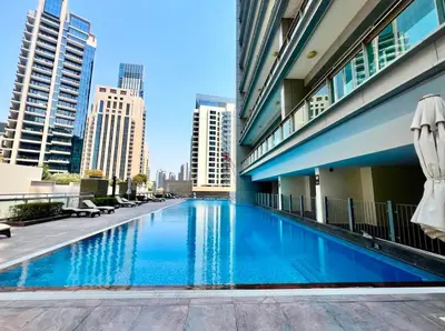 a swimming pool in the middle of a building at Downtown Apt - Near Burj Khalifa - Free Parking in Dubai