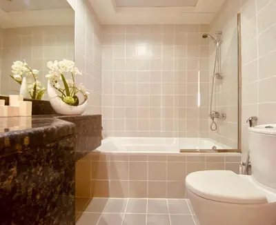 a bathroom with a toilet and a bath tub at Canal View Comfort Business Bay in Dubai