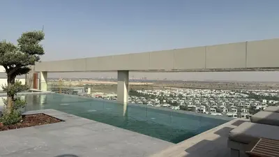 a swimming pool with a view of a city at Brand new fully furnished studio in Dubai
