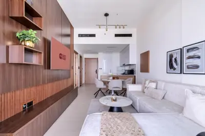 a living room with a couch and a table at GuestReady - Charming haven in JVC in Dubai