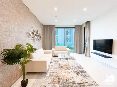 a living room with a couch and a tv at Spacious 2B in Sobha Creek Vistas ,Dubai in Dubai
