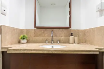 a bathroom counter with a sink and a mirror at 29 Boulevard by EMAAR 1BR 4min Walk to the Burj and Dubai Mall in Dubai