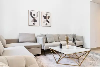 a living room with a couch and a table at 29 Boulevard by EMAAR 1BR 4min Walk to the Burj and Dubai Mall in Dubai