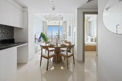 a kitchen and dining room with a table and chairs at Sky High 1BR in City View with 41st Floor Views in Dubai