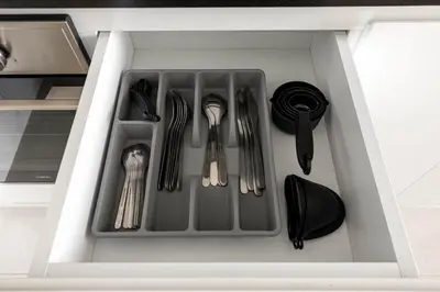 a drawer filled with utensils in a kitchen at Sky High 1BR in City View with 41st Floor Views in Dubai