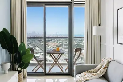 a living room with a floor to ceiling window with a table at Sky High 1BR in City View with 41st Floor Views in Dubai