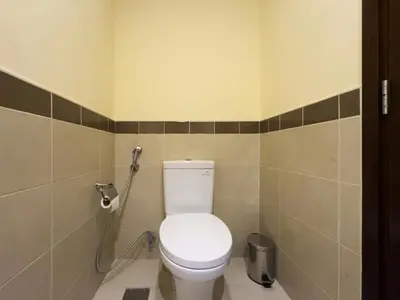 a bathroom with a white toilet in a stall at Golden Homes 29 blvd tower Urban nest 1BR Near Dubai mall & burj khalifa downtown dubai in Dubai