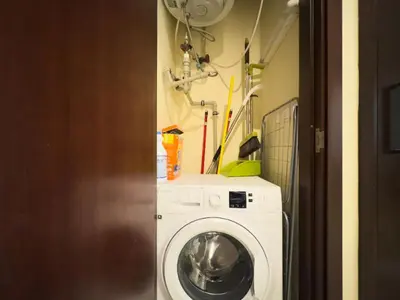a laundry room with a washing machine in a room at Golden Homes 29 blvd tower Urban nest 1BR Near Dubai mall & burj khalifa downtown dubai in Dubai