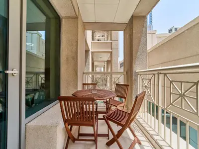 a patio with a table and chairs on a balcony at Golden Homes 29 blvd tower Urban nest 1BR Near Dubai mall & burj khalifa downtown dubai in Dubai