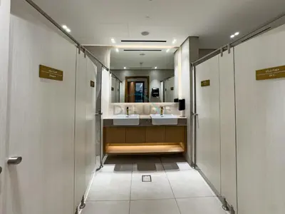 a bathroom with two sinks and a mirror at Studio Near Dubai Autodrome & Trump Golf Club, Binghatti Amber, JVC By Deluxe Holiday Homes in Dubai