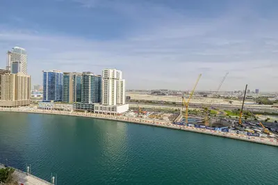 an aerial view of a city with a river and buildings at Daniels Studio with Canal View at Marasi Drive in Dubai