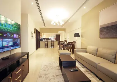 a living room with a couch and a flat screen tv at Luxury 2BR Apartment in Downtown Dubai Elite Stay in Dubai