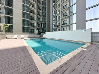 a swimming pool in the middle of a building at Trophy-Live in Style Artistic Flair Unit in Dubai