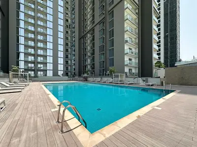 a large swimming pool in the middle of a building at Trophy-Live in Style Artistic Flair Unit in Dubai