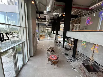 an empty room with chairs and tables in a building at Fully-equipped 1-br in Dubai Hills great amenities in Dubai