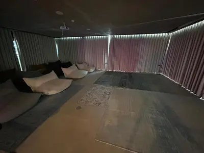 an empty room with white pillows in a room with curtains at Fully-equipped 1-br in Dubai Hills great amenities in Dubai