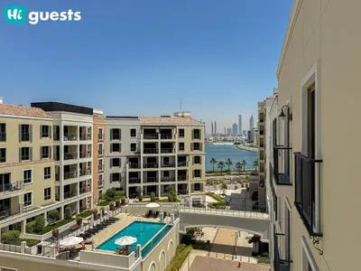 a view of a pool from a building at HiGuests - La Rive Living Classy 2BR with Balcony in Dubai