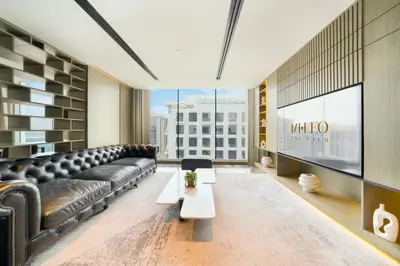 a living room with a couch and a table at Mileo Hotel The Palm in Dubai