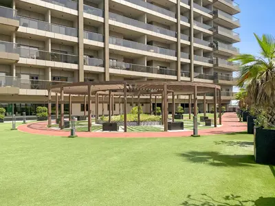 a large building with a pavilion in the middle of a lawn at Cozy Studio in Downtown Dubai in Dubai