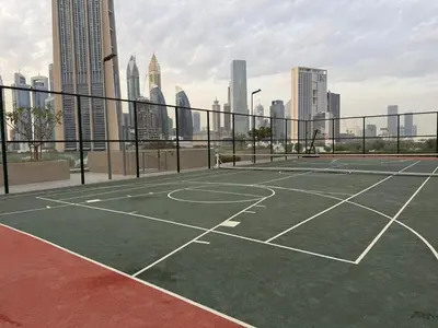 a tennis court in the middle of a city at Luxurious Downtown Views 2 bedrooms holiday home in Dubai