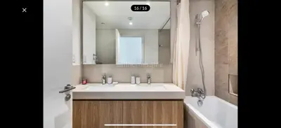 a bathroom with a sink and a bath tub and a sink at Luxurious Downtown Views 2 bedrooms holiday home in Dubai
