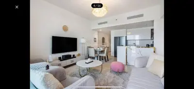 a living room with a couch and a table at Luxurious Downtown Views 2 bedrooms holiday home in Dubai
