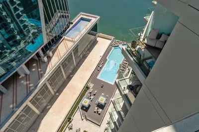 an overhead view of a swimming pool on a building at Upscale 1BR Luxury Apt in Business Bay in Dubai