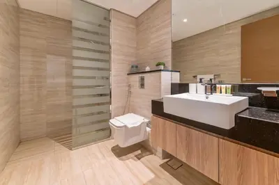 a bathroom with a sink and a shower and a toilet at Upscale 1BR Luxury Apt in Business Bay in Dubai