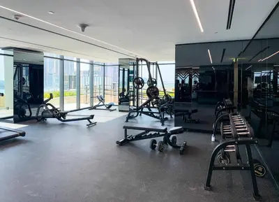 a gym with treadmills and exercise equipment in a building at Upscale 1BR Luxury Apt in Business Bay in Dubai