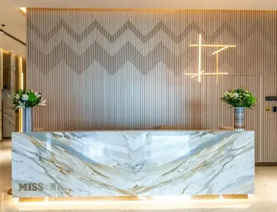 a lobby with a marble counter and a cross on the wall at Upscale 1BR Luxury Apt in Business Bay in Dubai
