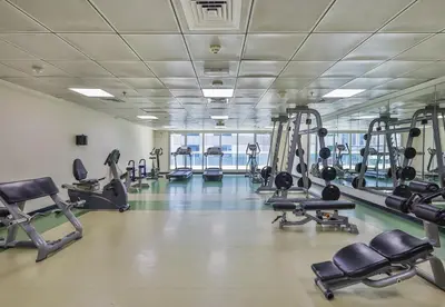 a gym with treadmills and cardio machines at Near Metro Station - 1BR in Marina Diamond 3, Dubai Marina - Allsopp & Allsopp in Dubai