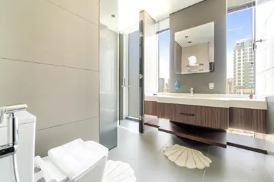 a bathroom with a sink and a mirror at Stylish 2BR in Royal MBL in Dubai