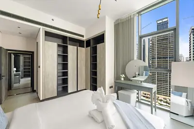 a bedroom with a view of the city at Stylish 2BR in Royal MBL in Dubai