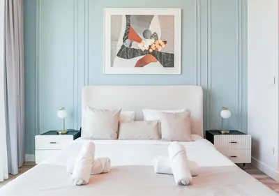 a bedroom with a large white bed with white pillows at Modern Stay at The Address JBR in Dubai