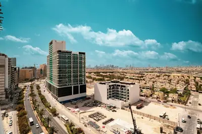 an aerial view of a city with tall buildings at Stylish 1BR with Spacious Terrace Near Circle Mall in Dubai