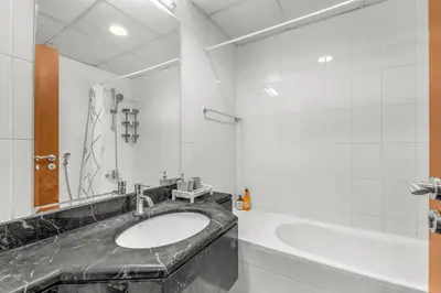 a bathroom with a sink and a tub at super Luxurious Apartment Downtown Dubai Mall burj khalifa DIFC in Dubai