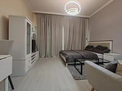 a hotel room with a bed and a couch at super Luxurious Apartment Downtown Dubai Mall burj khalifa DIFC in Dubai