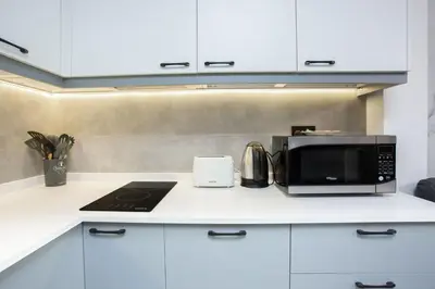 a kitchen counter with a microwave and a toaster oven at super Luxurious Apartment Downtown Dubai Mall burj khalifa DIFC in Dubai